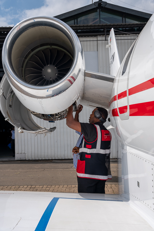 AMREF licensed engineer inspecting jet engine