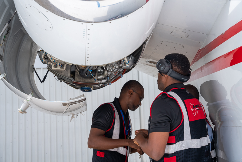 Engineers inspecting engine
